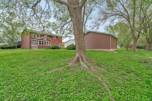 view of yard with a sunroom