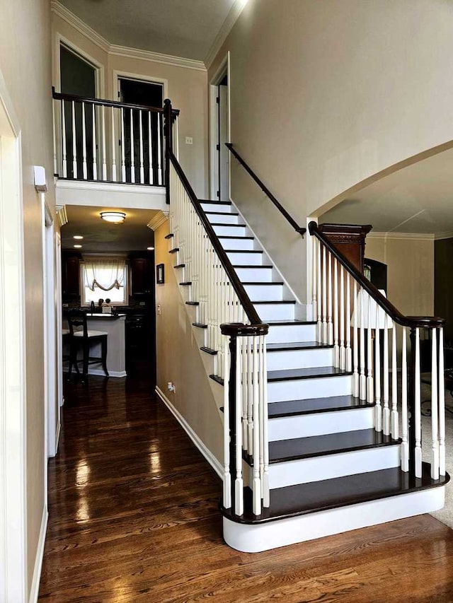 80 Chestnut Ct, Elgin, IL 60120 - staircase featuring crown molding, wood finished floors, a high ceiling, and baseboards
