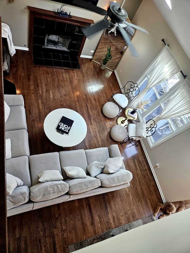 80 Chestnut Ct, Elgin, IL 60120 - living area with wood finished floors, ceiling fan, baseboards, and a fireplace
