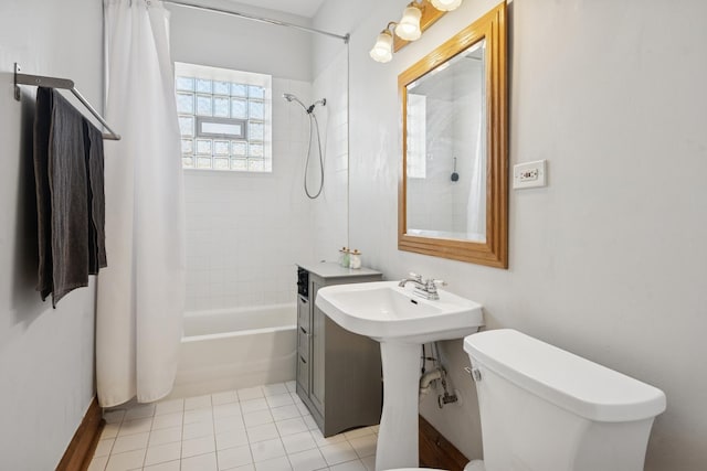 bathroom featuring shower / tub combo with curtain, tile patterned floors, and toilet