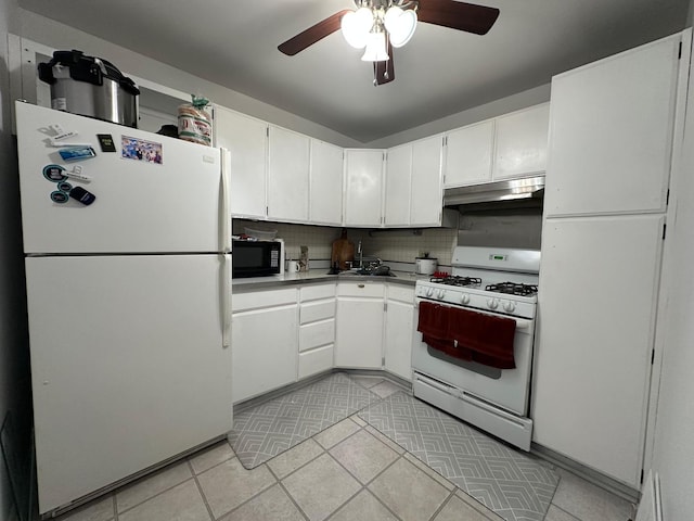 400 E Randolph St Unit 921, Chicago, IL 60601 - kitchen with a ceiling fan, white cabinetry, white appliances, under cabinet range hood, and tasteful backsplash