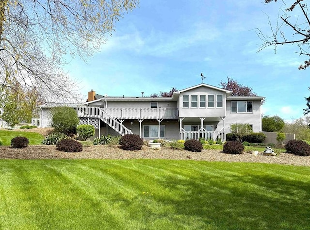 25-14 Country Hill Ct, Lake Carroll, IL 61046 - back of house featuring a wooden deck, a chimney, a lawn, and stairs
