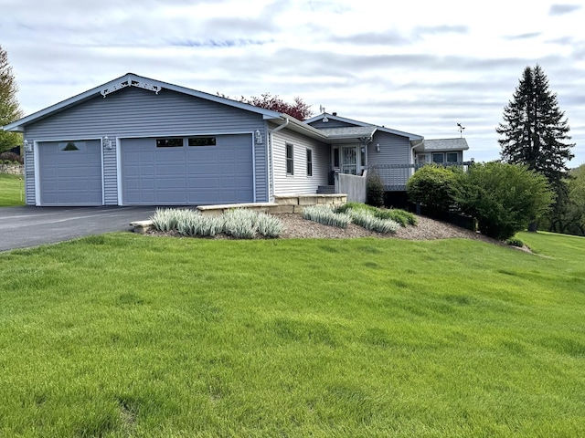 25-14 Country Hill Ct, Lake Carroll, IL 61046 - view of front of home with a front yard, a garage, and aphalt driveway