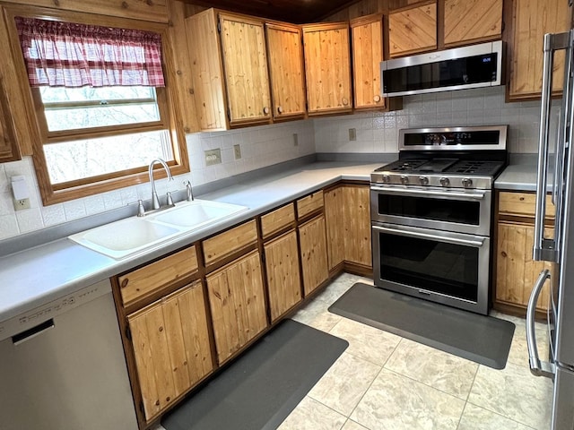 25-14 Country Hill Ct, Lake Carroll, IL 61046 - kitchen featuring light countertops, stainless steel appliances, tasteful backsplash, and a sink