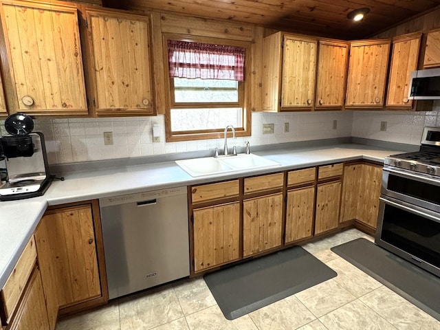 25-14 Country Hill Ct, Lake Carroll, IL 61046 - kitchen featuring stainless steel appliances, wood ceiling, a sink, decorative backsplash, and light countertops