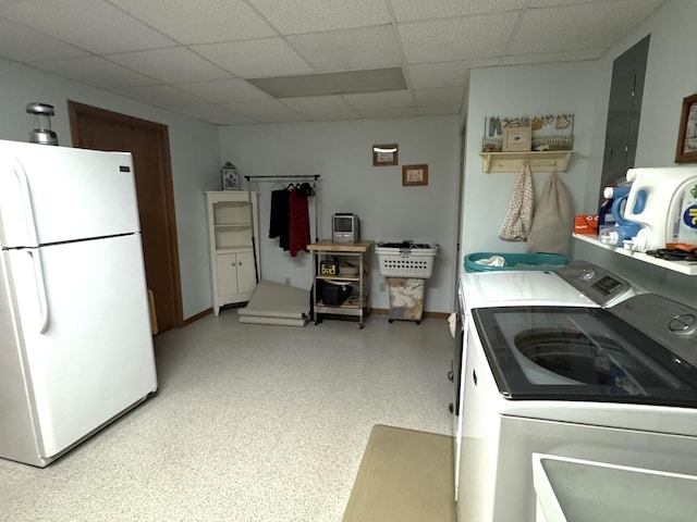 25-14 Country Hill Ct, Lake Carroll, IL 61046 - kitchen with freestanding refrigerator, independent washer and dryer, baseboards, and a paneled ceiling