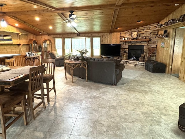 25-14 Country Hill Ct, Lake Carroll, IL 61046 - living area with wood walls, lofted ceiling with beams, a fireplace, a ceiling fan, and wood ceiling