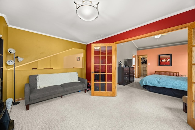 bedroom featuring carpet floors, visible vents, and ornamental molding