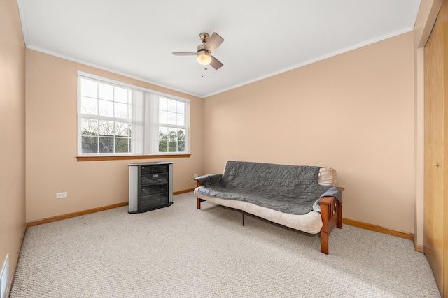 sitting room with crown molding, baseboards, wine cooler, and ceiling fan