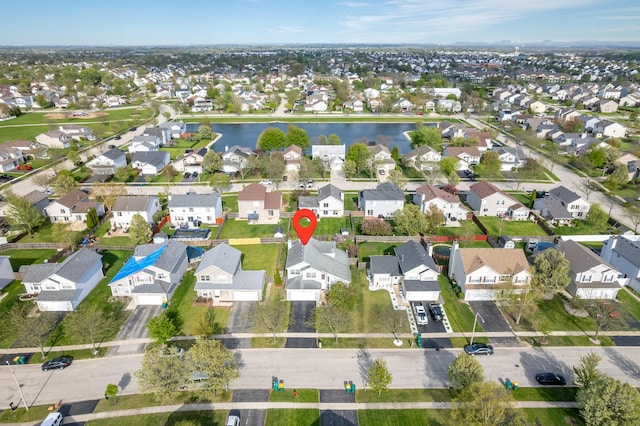 aerial view with a residential view and a water view