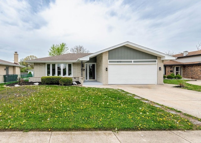 612 Thornwood Dr, South Holland, IL 60473 - view of front of property with a garage, a front lawn, fence, brick siding, and concrete driveway