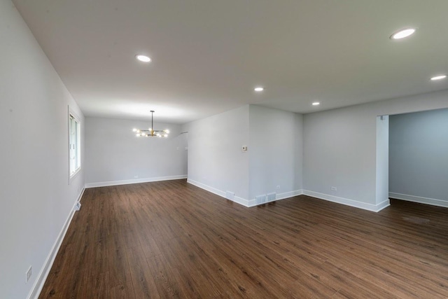 612 Thornwood Dr, South Holland, IL 60473 - empty room with baseboards, dark wood-type flooring, recessed lighting, and a chandelier