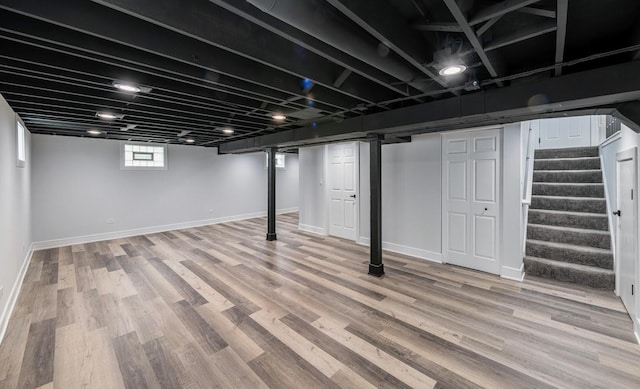 612 Thornwood Dr, South Holland, IL 60473 - below grade area with stairway, baseboards, and light wood finished floors
