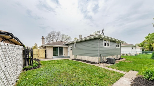 612 Thornwood Dr, South Holland, IL 60473 - back of property featuring brick siding, a fenced backyard, a gate, cooling unit, and a yard