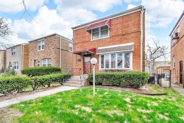 view of front of property featuring fence and brick siding