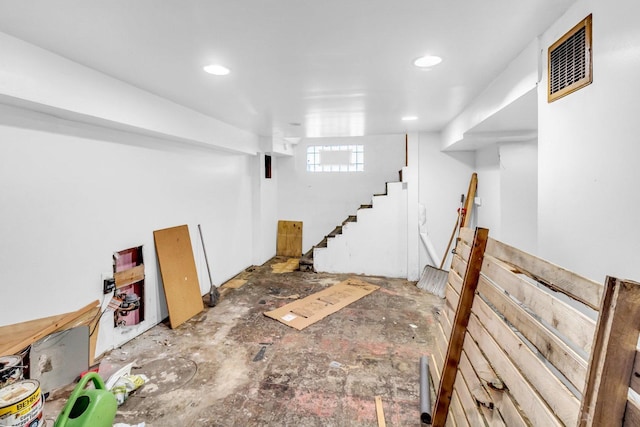 basement featuring recessed lighting and visible vents