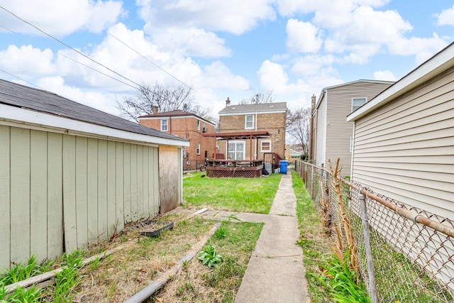 view of yard with a fenced backyard and a wooden deck