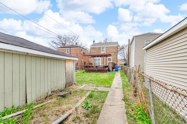 8619 S Jeffery Blvd, Chicago, IL 60617 - view of yard with a fenced backyard and a wooden deck