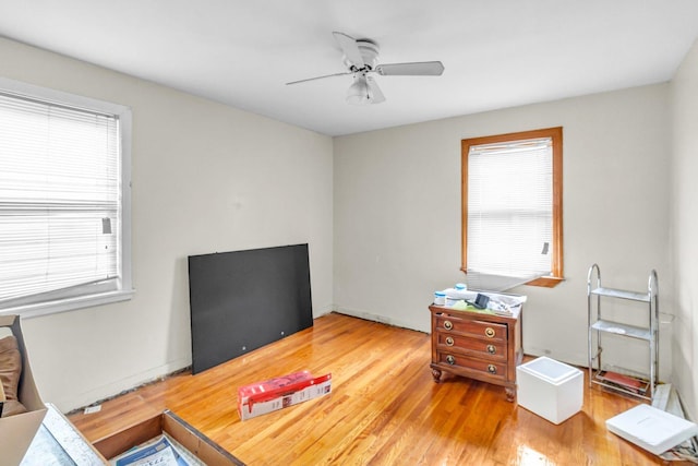 bedroom with ceiling fan and wood finished floors