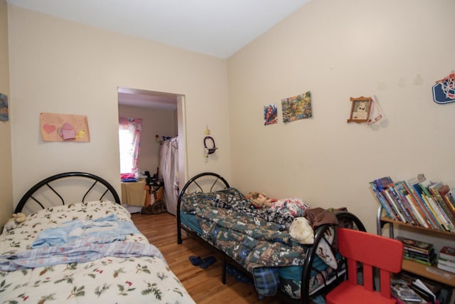 bedroom with wood finished floors