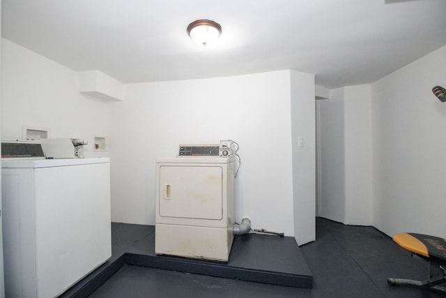 community laundry room featuring washer and clothes dryer