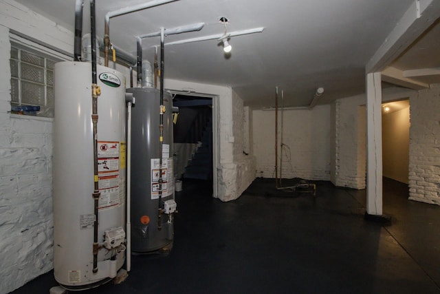 basement with water heater and stairway