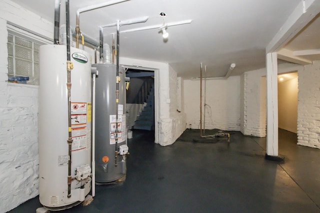 finished below grade area featuring water heater and stairway