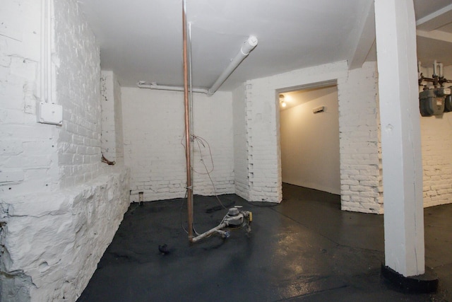 below grade area with brick wall