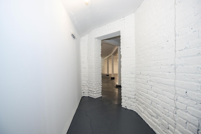 hall featuring finished concrete floors
