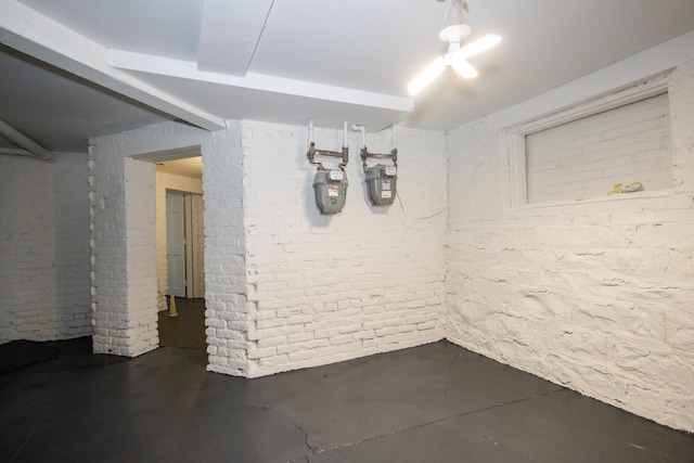 below grade area featuring brick wall