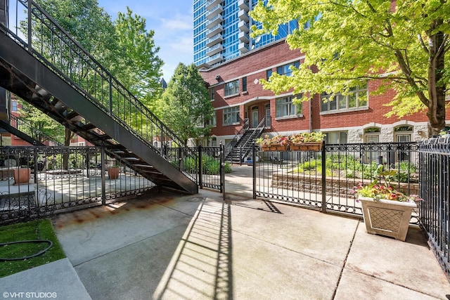 321 E 17th St, Chicago, IL 60616 - view of patio with stairway and fence