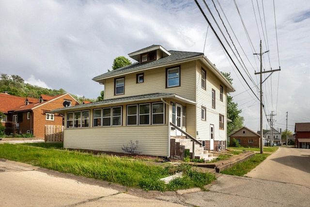 115 Van Buren St, Savanna, IL 61074 - traditional style home featuring entry steps, a sunroom, and a shingled roof