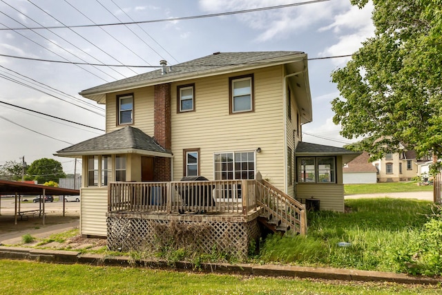 115 Van Buren St, Savanna, IL 61074 - rear view of property featuring a deck and a shingled roof