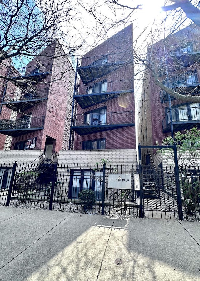 view of building exterior with a fenced front yard