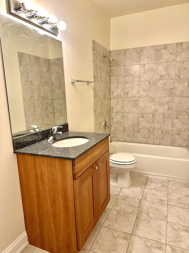 bathroom with vanity, shower / bathing tub combination, and toilet