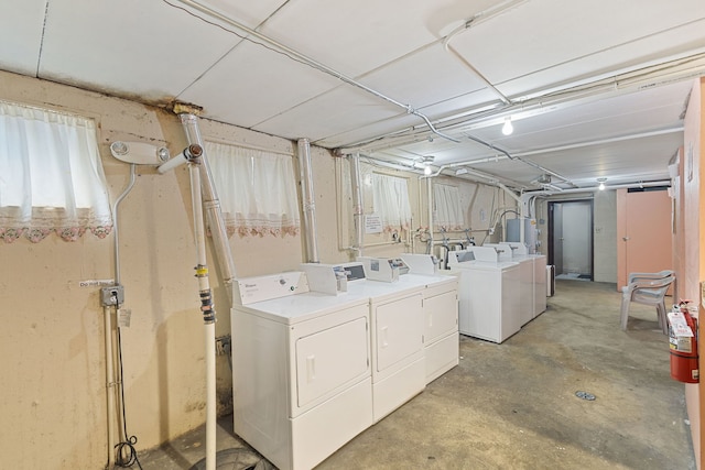laundry area with washing machine and clothes dryer