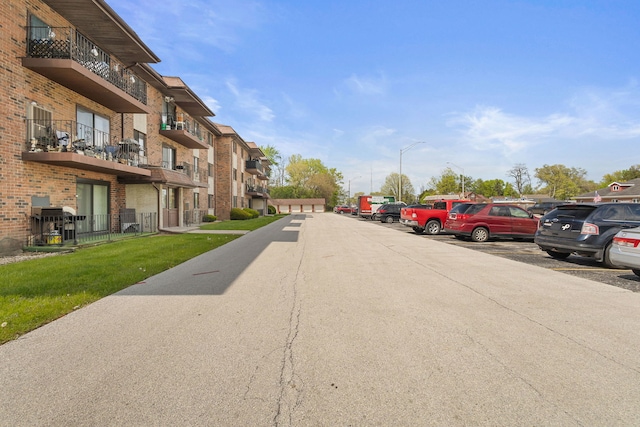 view of street with a residential view and street lights