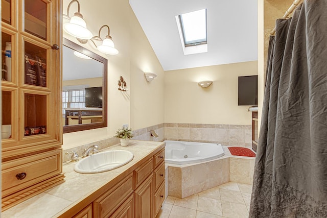 full bath with vanity, tile patterned floors, a garden tub, a shower with curtain, and lofted ceiling with skylight