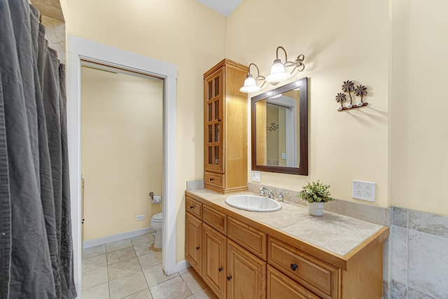 bathroom with toilet and vanity