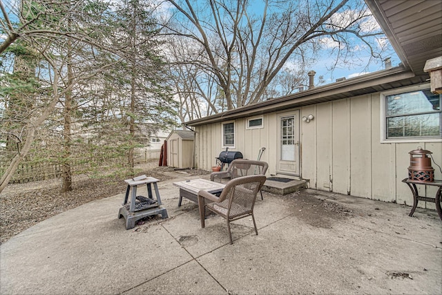view of patio with an outdoor structure, a storage shed, and a grill