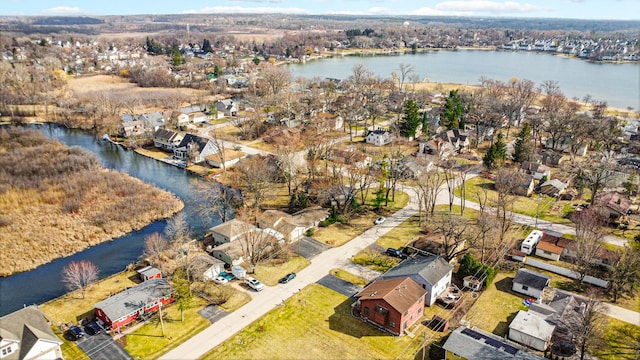 birds eye view of property featuring a residential view and a water view