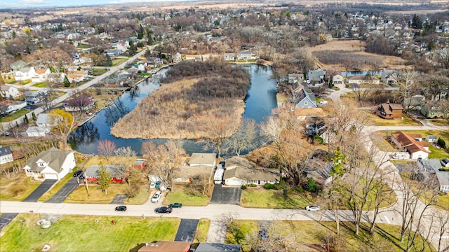bird's eye view featuring a water view and a residential view