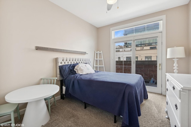 bedroom featuring ceiling fan, light colored carpet, and baseboards