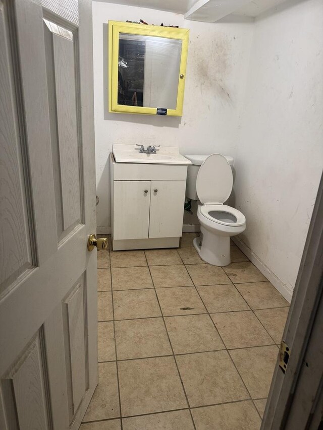 7328 S May St, Chicago, IL 60621 - half bathroom featuring toilet, tile patterned floors, and vanity