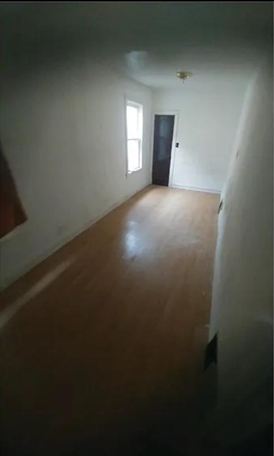 7328 S May St, Chicago, IL 60621 - unfurnished room featuring wood finished floors