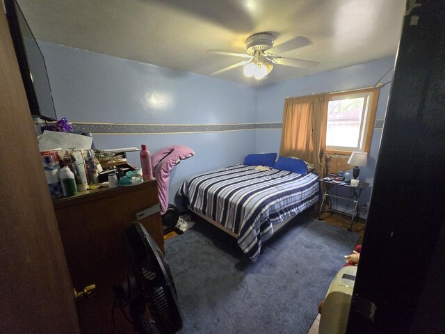 bedroom with carpet floors and a ceiling fan