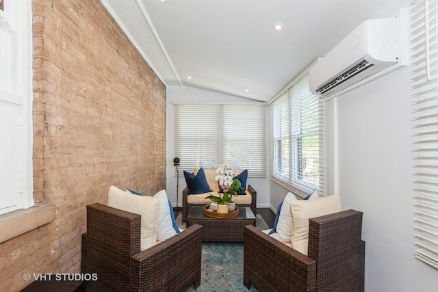 sunroom / solarium with a wall mounted air conditioner and vaulted ceiling