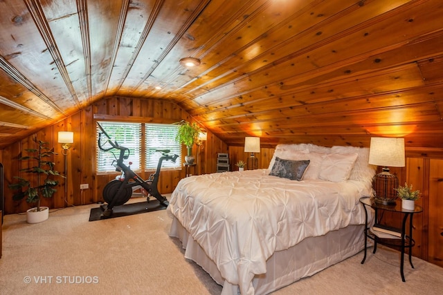 bedroom with carpet, lofted ceiling, and wooden walls