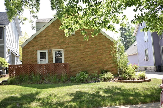 33 N Spring Ave, La Grange, IL 60525 - view of home's exterior featuring brick siding and a lawn