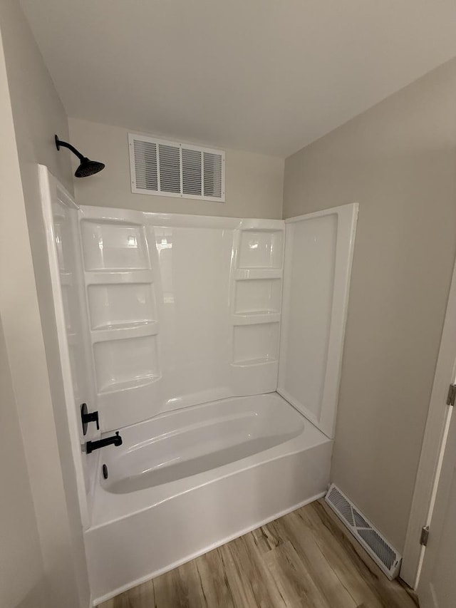 405 9th St, Mazon, IL 60444 - full bath featuring visible vents, tub / shower combination, and wood finished floors